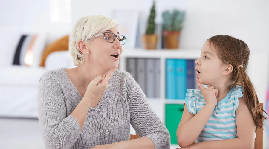 a woman therapist with a kid