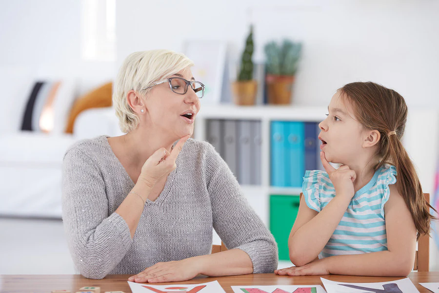 a woman therapist with a kid